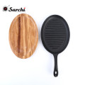 cast iron skillet sizzling plate with vegetable oil coating fajita pan